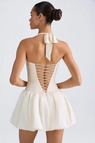 Rochie micro mini cu corset, cu decolteu în V și șnururi, cu tiv bufant, Ludmila, în culoarea Ivory Rochie micro mini cu corset, cu decolteu în V și șnururi, cu tiv bufant, Ludmila, în culoarea Ivory