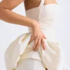 Rochie micro mini cu corset, cu decolteu în V și șnururi, cu tiv bufant, Ludmila, în culoarea Ivory Rochie micro mini cu corset, cu decolteu în V și șnururi, cu tiv bufant, Ludmila, în culoarea Ivory