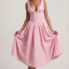 Rochie midi A-line cu detaliu fundă, broderie englezească, de la Saidey, în roz pal Rochie midi A-line cu detaliu fundă, broderie englezească, de la Saidey, în roz pal