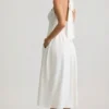 Rochie midi albă cu gât halter și detalii cu nasturi Orlena Rochie midi albă cu gât halter și detalii cu nasturi Orlena