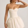 Rochie midi-ax Gloriana convertibilă, cu detaliu fundă și tiv bufant, în culoarea ivoriu