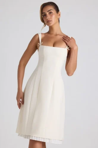 Rochie midi plisată în A cu detaliu fundă Isadora, culoare ivoriu Rochie midi plisată în A cu detaliu fundă Isadora, culoare ivoriu
