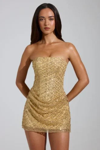 Rochie mini A-line cu bandă și ornamente Amalina, în culoarea auriu Rochie mini A-line cu bandă și ornamente Amalina, în culoarea auriu