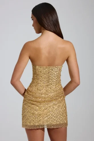 Rochie mini A-line cu bandă și ornamente Amalina, în culoarea auriu Rochie mini A-line cu bandă și ornamente Amalina, în culoarea auriu
