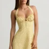 Rochie mini A-line cu gât halter Nerine cu imprimeu floral galben Rochie mini A-line cu gât halter Nerine cu imprimeu floral galben