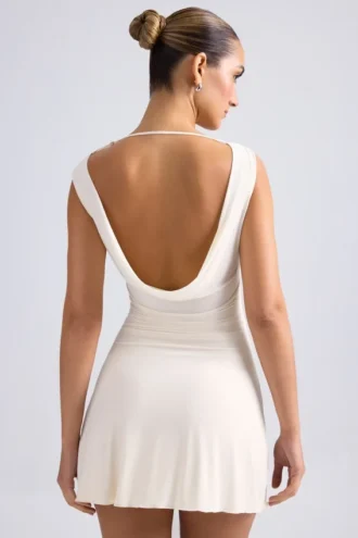 Rochie mini A-line cu umeri decupați și spate în formă de cap de balenă Tigen, culoare ivoriu
