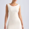 Rochie mini A-line cu umeri decupați și spate în formă de cap de balenă Tigen, culoare ivoriu