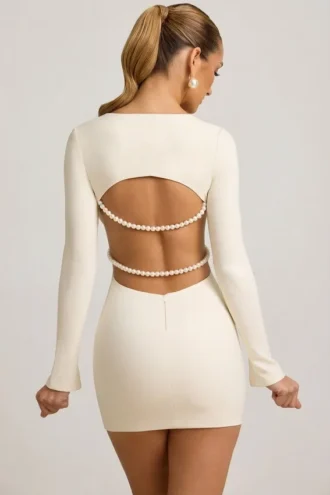 Rochie mini Akari cu decupaje și detalii cu perle, în culoarea ivoriu Rochie mini Akari cu decupaje și detalii cu perle, în culoarea ivoriu