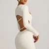 Rochie mini Akari cu decupaje și detalii cu perle, în culoarea ivoriu