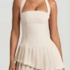 Rochie mini asimetrică cu gât halter și straturi, model Rosaria, în culoarea ivoriu
