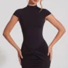 Rochie mini Blair din jersey cu guler înalt, cu volane și spate decupat, în culoarea neagră Rochie mini Blair din jersey cu guler înalt, cu volane și spate decupat, în culoarea neagră