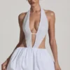 Rochie mini Cece cu decupaje și tiv bufant, în alb