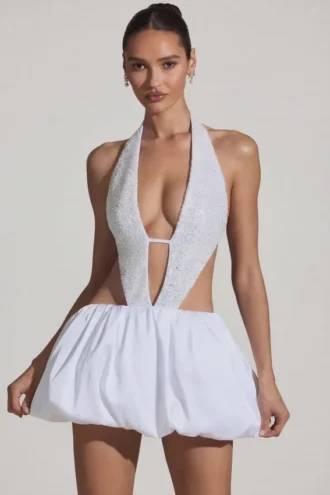 Rochie mini Cece cu decupaje și tiv bufant, în alb