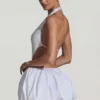 Rochie mini Cece cu decupaje și tiv bufant, în alb