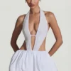 Rochie mini Cece cu decupaje și tiv bufant, în alb