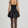 Rochie mini Cirilla cu detalii cu fundițe și tiv bufant, în negru
