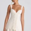 Rochie mini corset Cassandra cu volane și detalii cu nasturi, culoare ivoriu