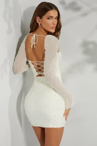 Rochie mini corset cu mâneci lungi și ornamente, model Milan, culoare ivoriu Rochie mini corset cu mâneci lungi și ornamente, model Milan, culoare ivoriu