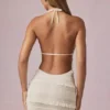 Rochie mini cu volane, fără spate și cu gât halter, de culoare ivoriu, marca Tarryn Rochie mini cu volane, fără spate și cu gât halter, de culoare ivoriu, marca Tarryn