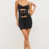 Rochie mini decupată Aniela din jersey elastic cu detalii de trandafiri, în negru Rochie mini decupată Aniela din jersey elastic cu detalii de trandafiri, în negru