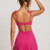 Rochie mini decupată Emilion cu ornamente, în culoarea fucsia Rochie mini decupată Emilion cu ornamente, în culoarea fucsia
