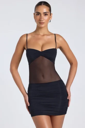 Rochie mini Eislyn cu panouri transparente și volane, în culoarea neagră Rochie mini Eislyn cu panouri transparente și volane, în culoarea neagră
