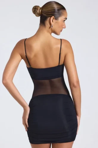 Rochie mini Eislyn cu panouri transparente și volane, în culoarea neagră Rochie mini Eislyn cu panouri transparente și volane, în culoarea neagră