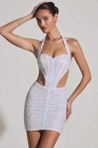 Rochie mini Lucia cu decupaje și gât halter, în alb Rochie mini Lucia cu decupaje și gât halter, în alb