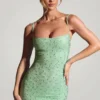 Rochie mini mulată cu ornamente Aellin în culoarea fistic