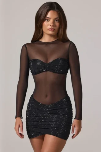 Rochie mini Noel cu guler înalt, mâneci lungi și decorațiuni transparente, în culoarea negru Rochie mini Noel cu guler înalt, mâneci lungi și decorațiuni transparente, în culoarea negru