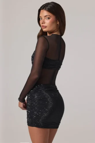 Rochie mini Noel cu guler înalt, mâneci lungi și decorațiuni transparente, în culoarea negru Rochie mini Noel cu guler înalt, mâneci lungi și decorațiuni transparente, în culoarea negru