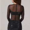 Rochie mini Noel cu guler înalt, mâneci lungi și decorațiuni transparente, în culoarea negru