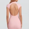 Rochie mini roz cu guler înalt din jersey Blair, cu spate decupat și drapaj