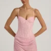 Rochie mini semi-transparentă, drapată, cu corset și ornamente, model Connie, în roz Rochie mini semi-transparentă, drapată, cu corset și ornamente, model Connie, în roz