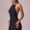 Rochie mini Tarryn cu volane, decolteu halter și spate decupat, în negru Rochie mini Tarryn cu volane, decolteu halter și spate decupat, în negru