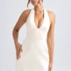 Rochie mini tulip structurată cu gât halter Harmonia, culoare ivoriu Rochie mini tulip structurată cu gât halter Harmonia, culoare ivoriu