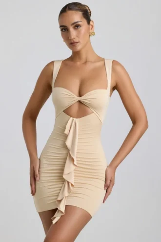 Rochie mini Zivanka din jersey elastic, cu decupaje și volane, în culoarea Buttercream Rochie mini Zivanka din jersey elastic, cu decupaje și volane, în culoarea Buttercream