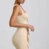 Rochie mini Zivanka din jersey elastic, cu decupaje și volane, în culoarea Buttercream