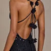 Rochie neagră cu decolteu adânc și spate decupat, cu ornamente Etoile Rochie neagră cu decolteu adânc și spate decupat, cu ornamente Etoile