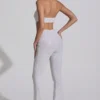 Salopetă Coralena cu decupaje și ornamente, în culoarea albă Salopetă Coralena cu decupaje și ornamente, în culoarea albă