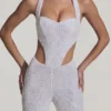 Salopetă Coralena cu decupaje și ornamente, în culoarea albă Salopetă Coralena cu decupaje și ornamente, în culoarea albă
