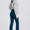 Salopetă impermeabilă cu talie înaltă și bretele, de culoare verde-albăstrui Salopetă impermeabilă cu talie înaltă și bretele, de culoare verde-albăstrui