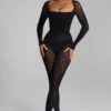 Salopeta Irina din tricot fără cusături, cu mâneci lungi, în culoarea neagră Salopeta Irina din tricot fără cusături, cu mâneci lungi, în culoarea neagră