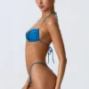 Top de bikini cu decolteu halter, cu volane și ornamente, model Clearwater, în albastru ocean Top de bikini cu decolteu halter, cu volane și ornamente, model Clearwater, în albastru ocean