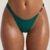 Slipuri de bikini Palau cu tăietură înaltă și ornamente din mărgele, în culoarea verde jad Slipuri de bikini Palau cu tăietură înaltă și ornamente din mărgele, în culoarea verde jad