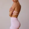 Sutien bandeau cu bretele încrucișate pe spate, în roz pal Sutien bandeau cu bretele încrucișate pe spate, în roz pal