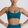 Sutien sport fără cusături Super Sculpt cu bretele încrucișate pe spate, culoare verde-albăstrui Sutien sport fără cusături Super Sculpt cu bretele încrucișate pe spate, culoare verde-albăstrui