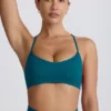 Sutien sport fără cusături Super Sculpt cu bretele încrucișate pe spate, culoare verde-albăstrui Sutien sport fără cusături Super Sculpt cu bretele încrucișate pe spate, culoare verde-albăstrui