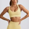 Sutien sport fără cusături Super Sculpt cu bretele încrucișate pe spate, în culoarea galben unt Sutien sport fără cusături Super Sculpt cu bretele încrucișate pe spate, în culoarea galben unt