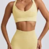 Sutien sport fără cusături Super Sculpt cu bretele încrucișate pe spate, în culoarea galben unt Sutien sport fără cusături Super Sculpt cu bretele încrucișate pe spate, în culoarea galben unt